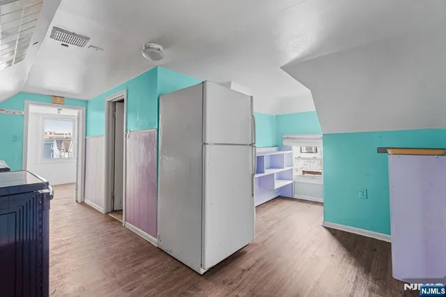a kitchen with a refrigerator a sink and dishwasher