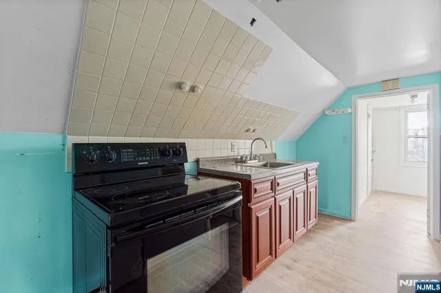 a kitchen with a stove and a sink