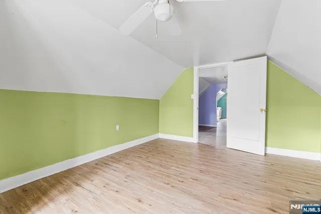 a view of room with wooden floor