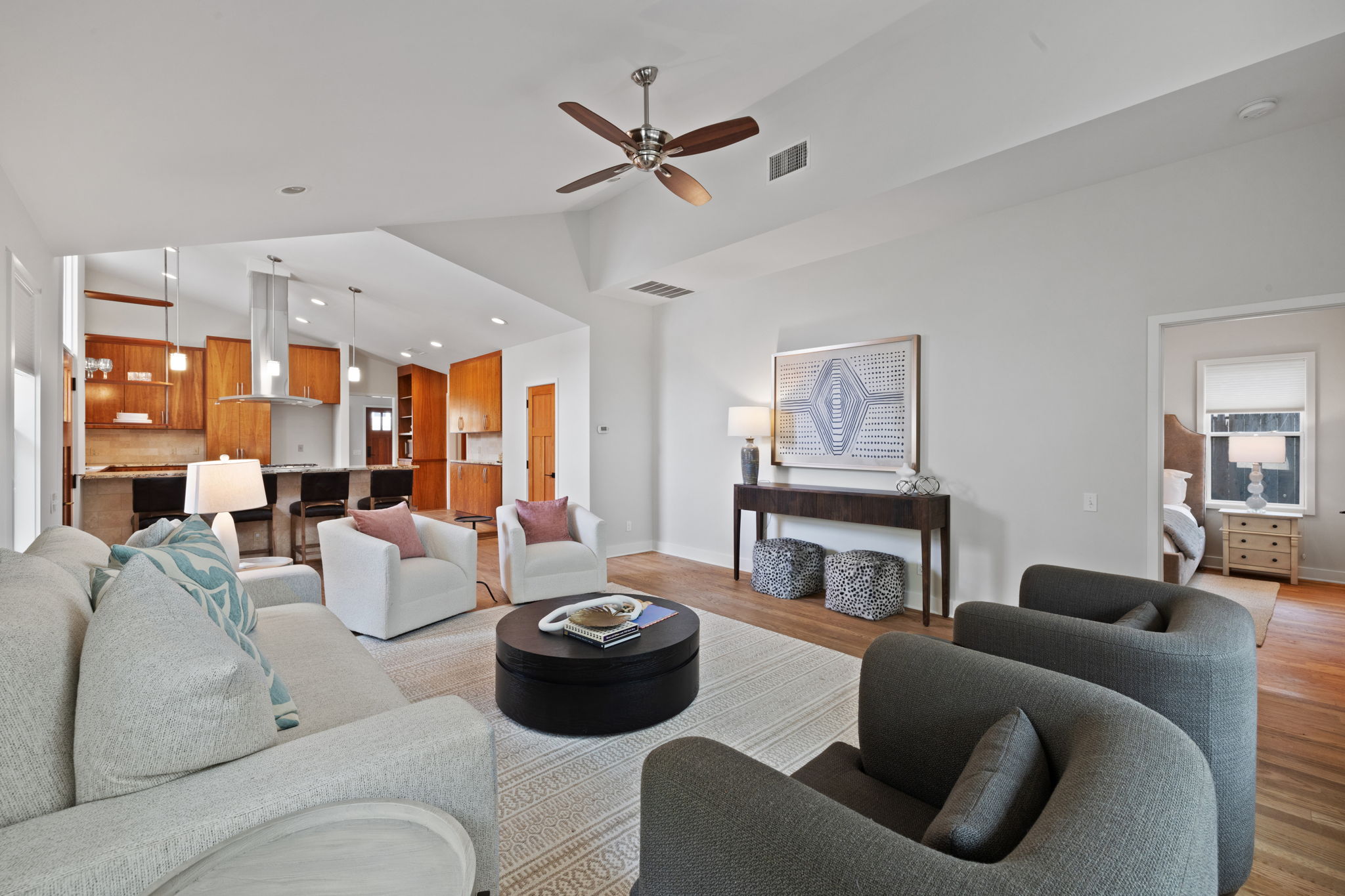 2300 South 3rd Street Austin, TX 78704 - Photo 17 of 39 Living room featuring light wood-style floors, ceiling fan, and visible vents