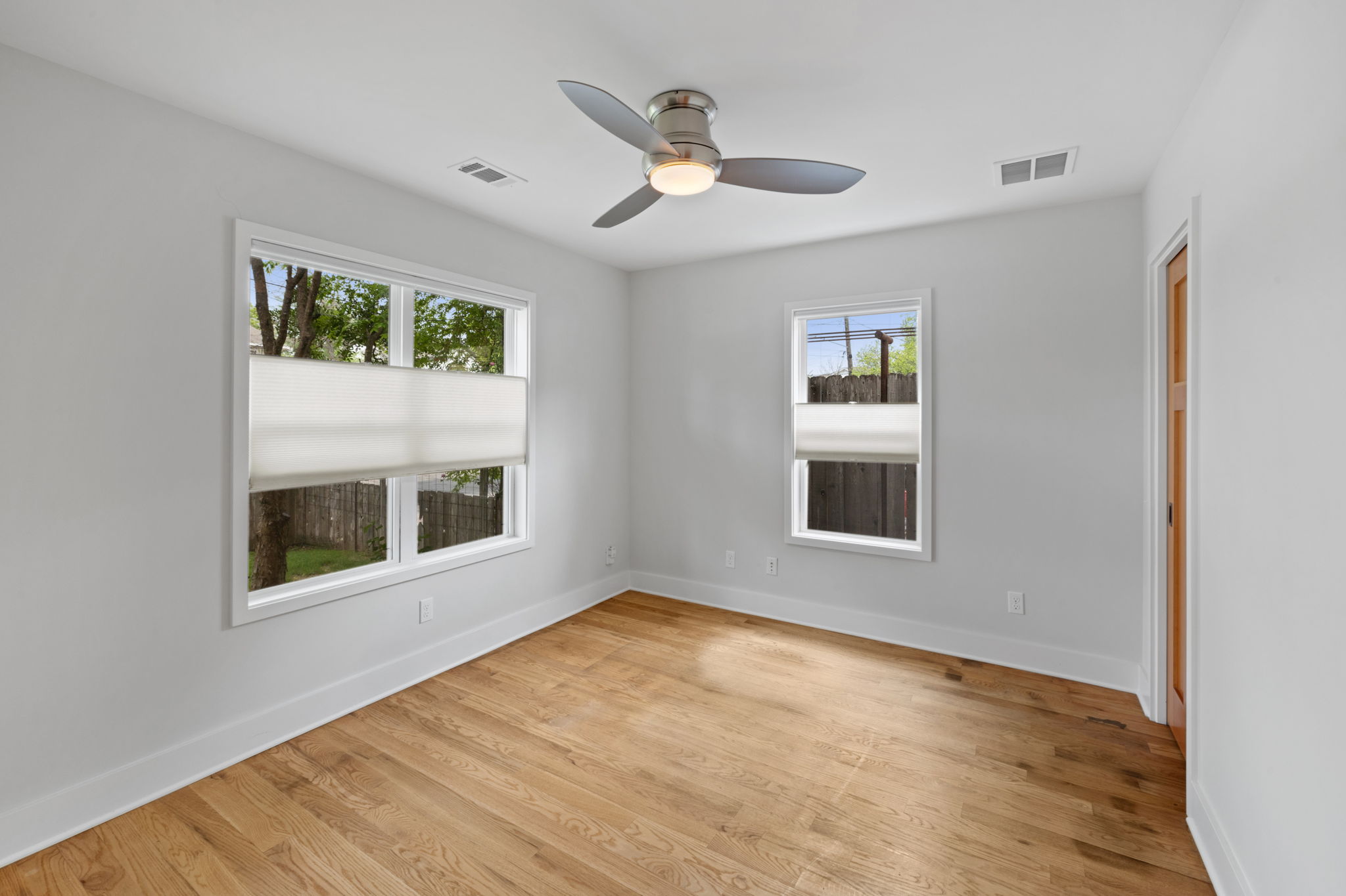 2300 South 3rd Street Austin, TX 78704 - Photo 19 of 39 Unfurnished room featuring light wood-type flooring, baseboards, and visible vents