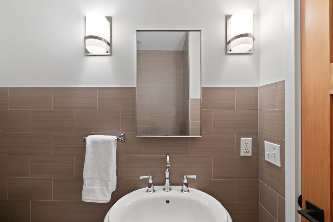 2300 South 3rd Street Austin, TX 78704 - Photo 24 of 39 a bathroom with a sink a toilet and mirror