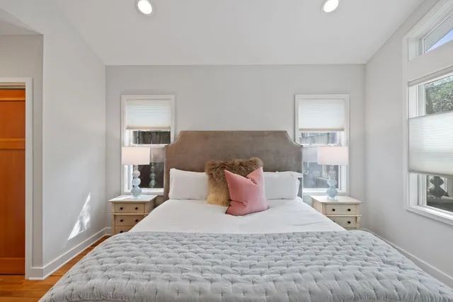 a view of entryway with a front door and wooden floor