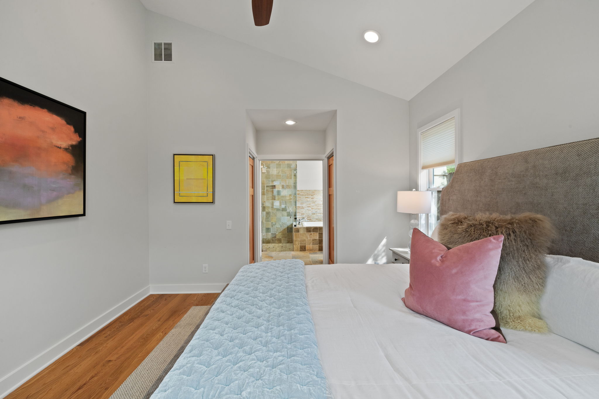 2300 South 3rd Street Austin, TX 78704 - Photo 29 of 39 Bedroom featuring baseboards, visible vents, wood finished floors, and lofted ceiling