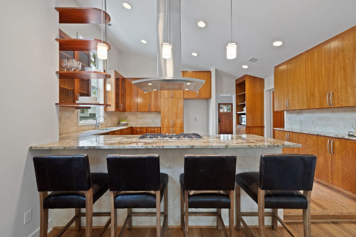 2300 South 3rd Street Austin, TX 78704 - Photo 10 of 39 a kitchen with stainless steel appliances granite countertop a sink and cabinets