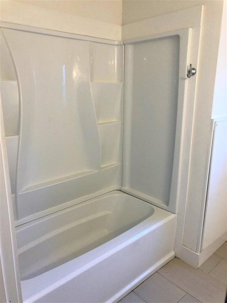 53 Rosin Cup Circle Santa Rosa Beach, FL 32459 - Photo 13 of 22 a bathroom with a shower and a bath tub