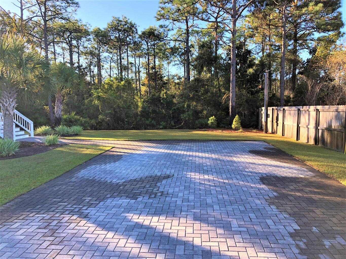 53 Rosin Cup Circle Santa Rosa Beach, FL 32459 - Photo 20 of 22 a view of swimming pool with trees in the background