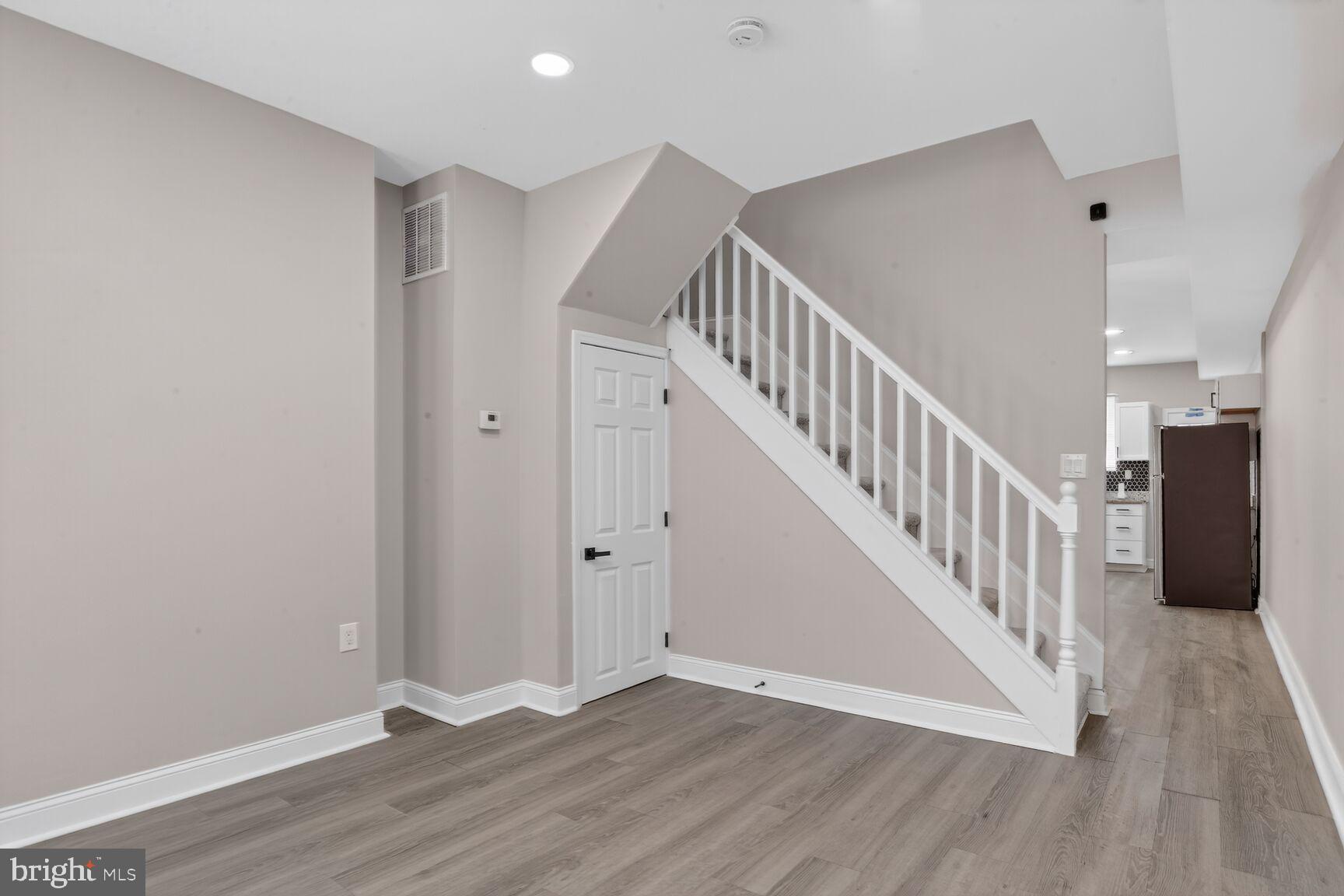 1106 South Carey Street Baltimore, MD 21223 - Photo 2 of 24 a view of entryway with wooden floor