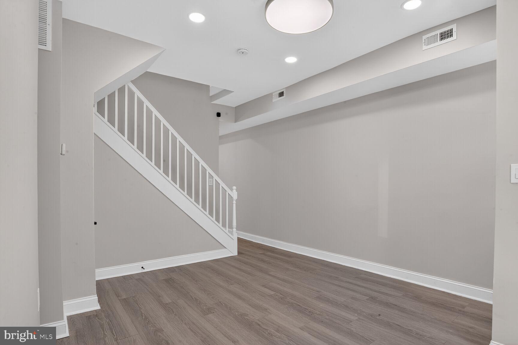 1106 South Carey Street Baltimore, MD 21223 - Photo 3 of 24 a view of entryway with wooden floor