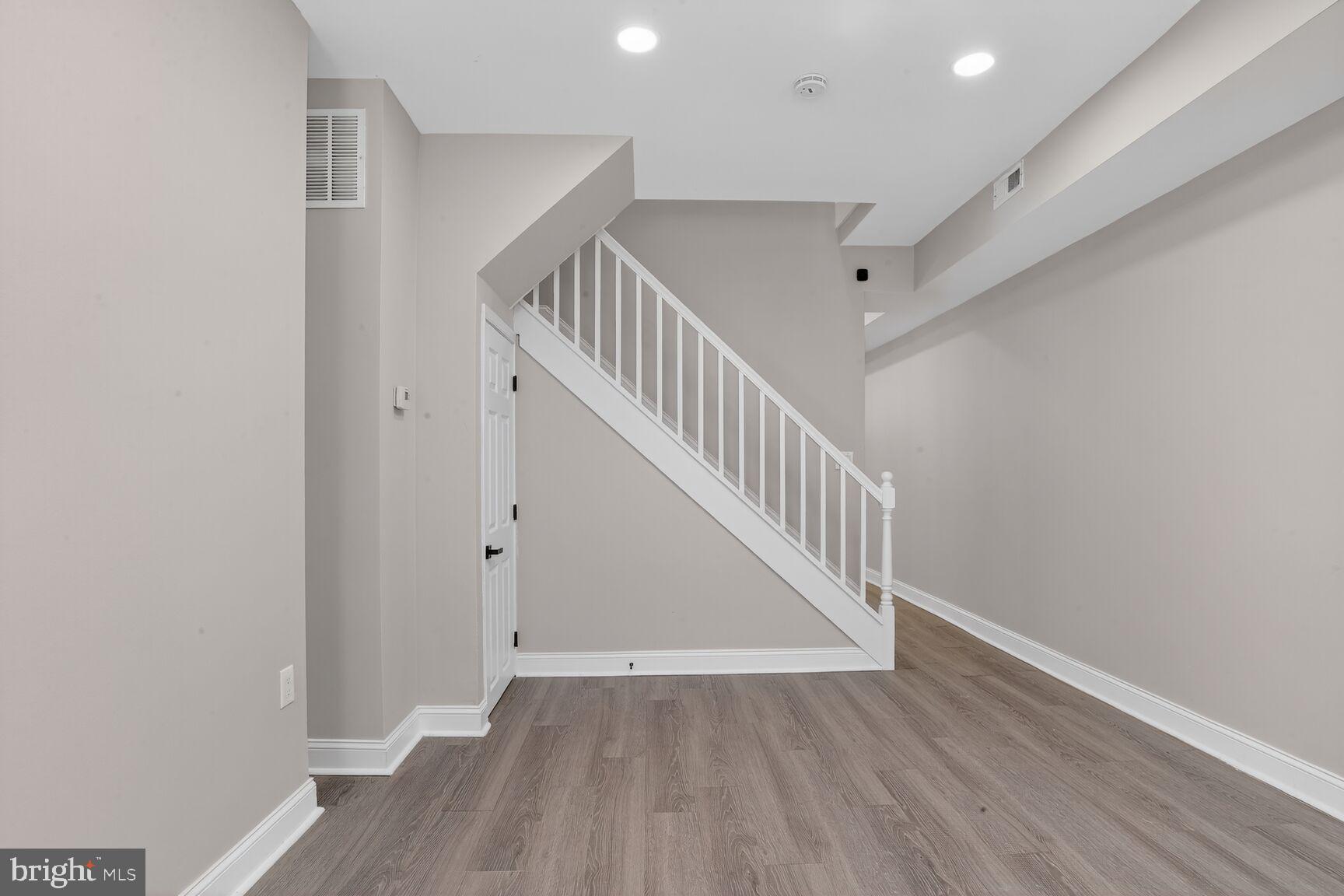 1106 South Carey Street Baltimore, MD 21223 - Photo 4 of 24 a view of entryway with wooden floor