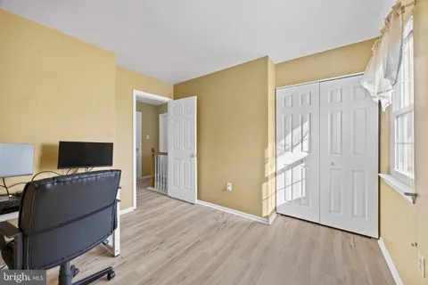 a workspace with furniture and wooden floor