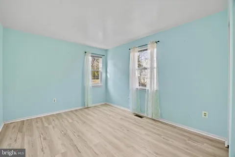 a room with gym equipment and a flat screen tv