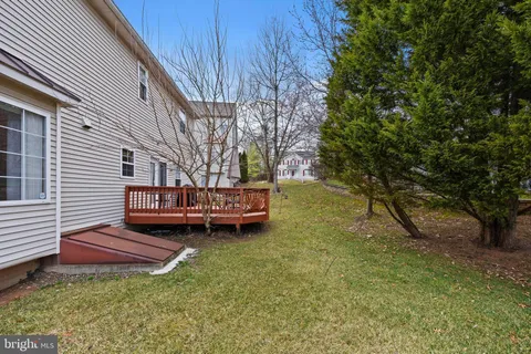 an aerial view of a house with a swimming pool