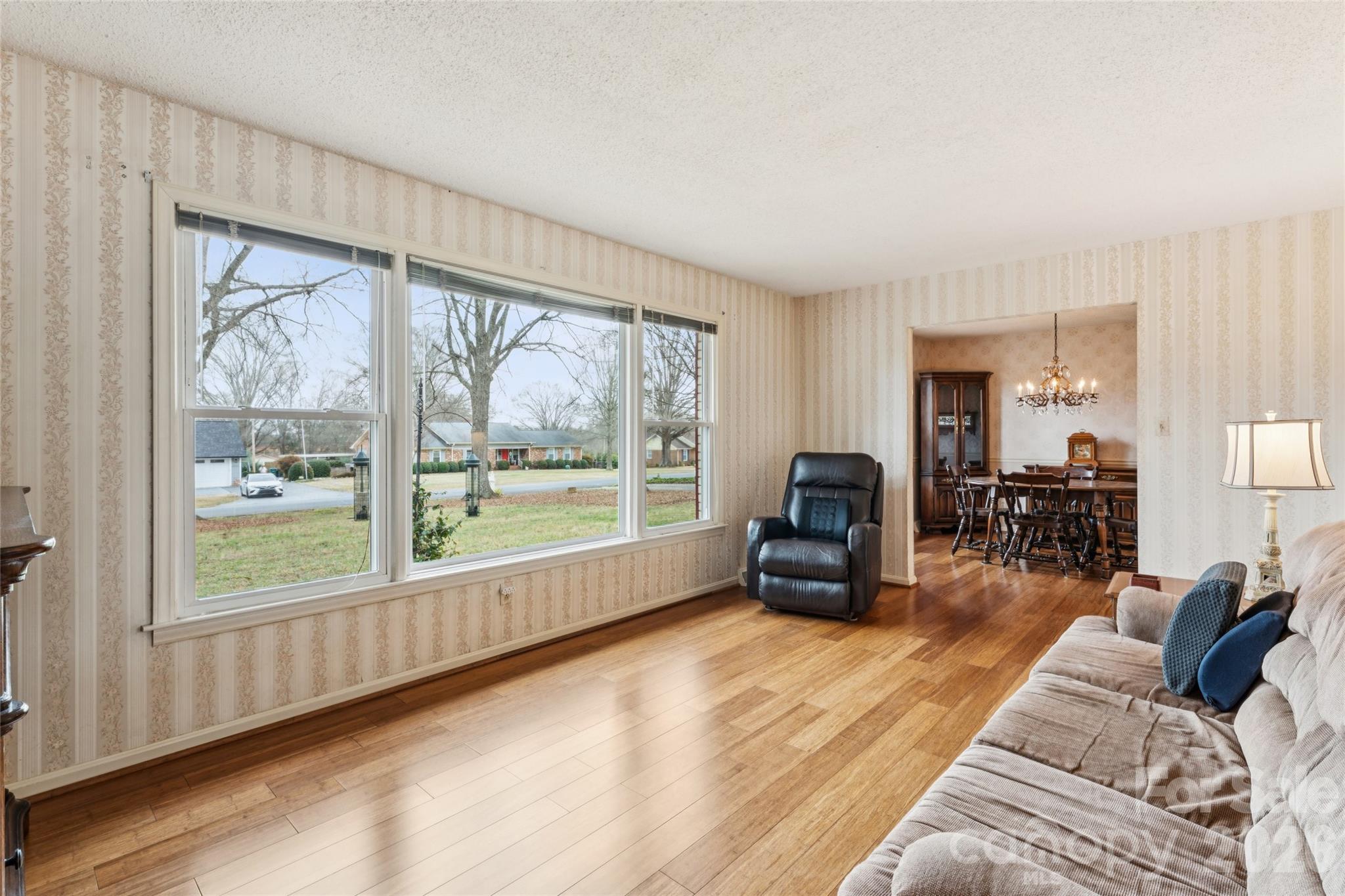 14409 Springwater Drive Matthews, NC 28105 - Photo 15 of 27 a living room with furniture and a large window