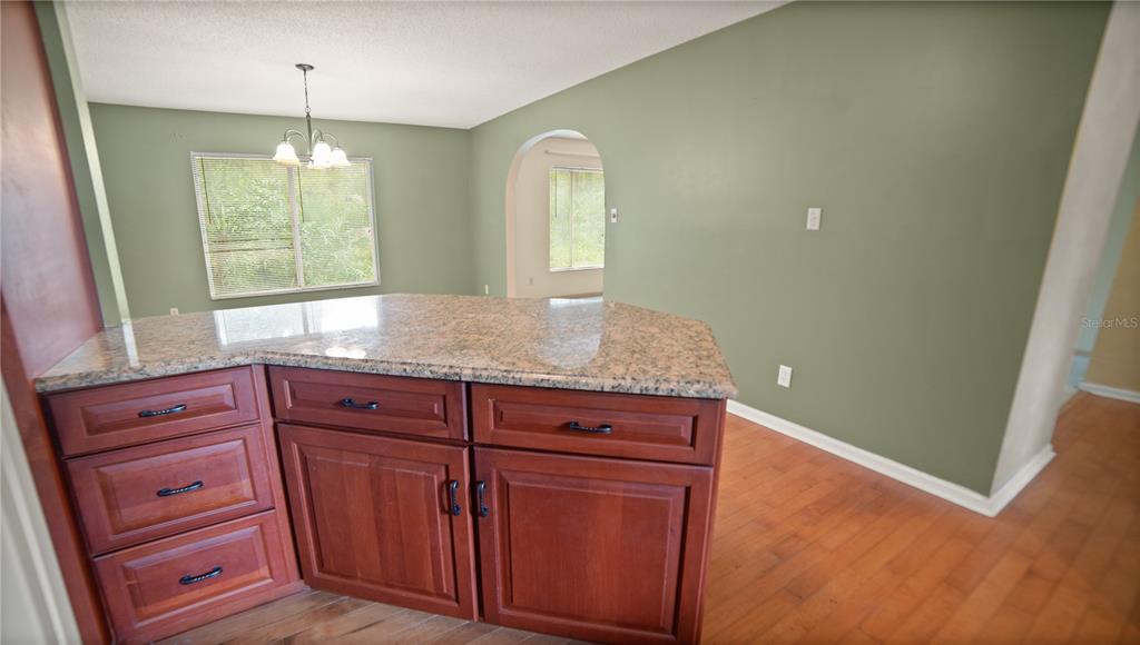 135 East Citrus Street Altamonte Springs, FL 32701 - Photo 12 of 33 a bathroom with a granite countertop sink and a mirror