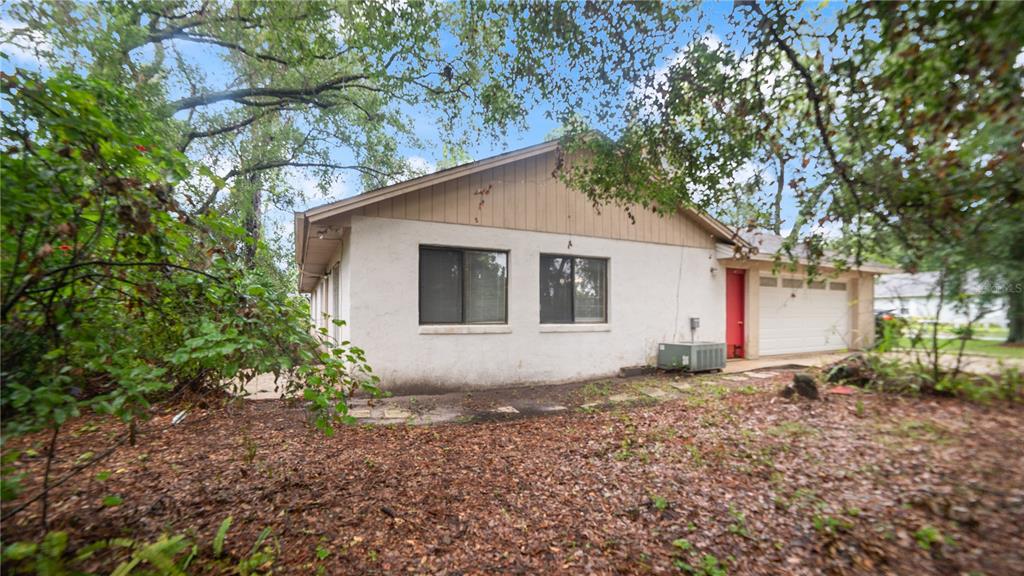 135 East Citrus Street Altamonte Springs, FL 32701 - Photo 29 of 33 a view of a house with a yard and large tree