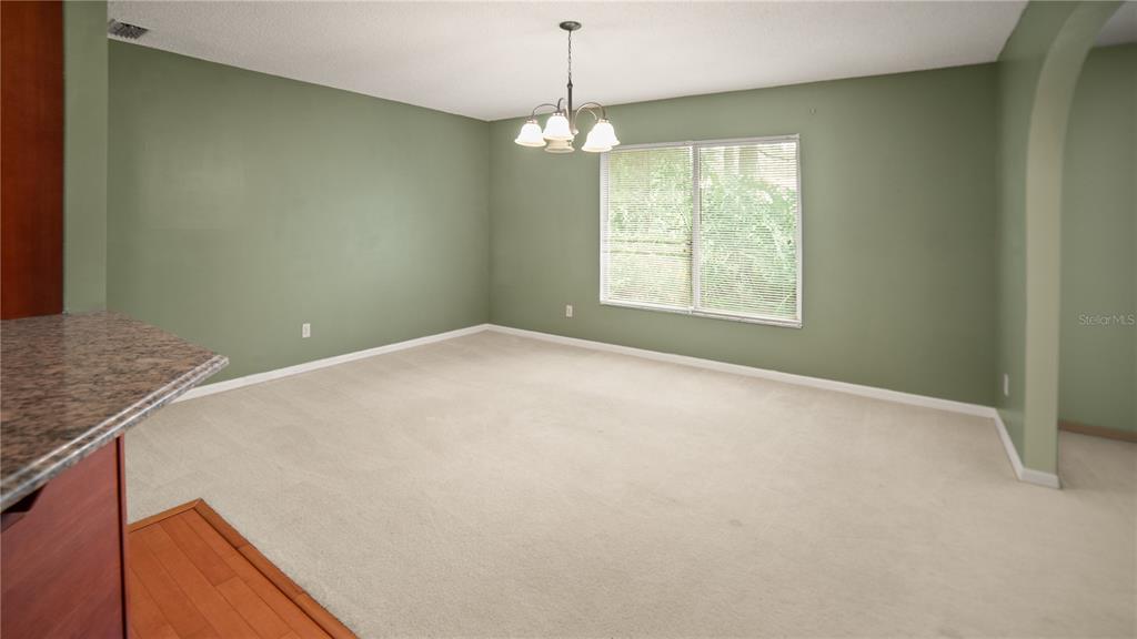 135 East Citrus Street Altamonte Springs, FL 32701 - Photo 8 of 33 a view of an empty room with a window
