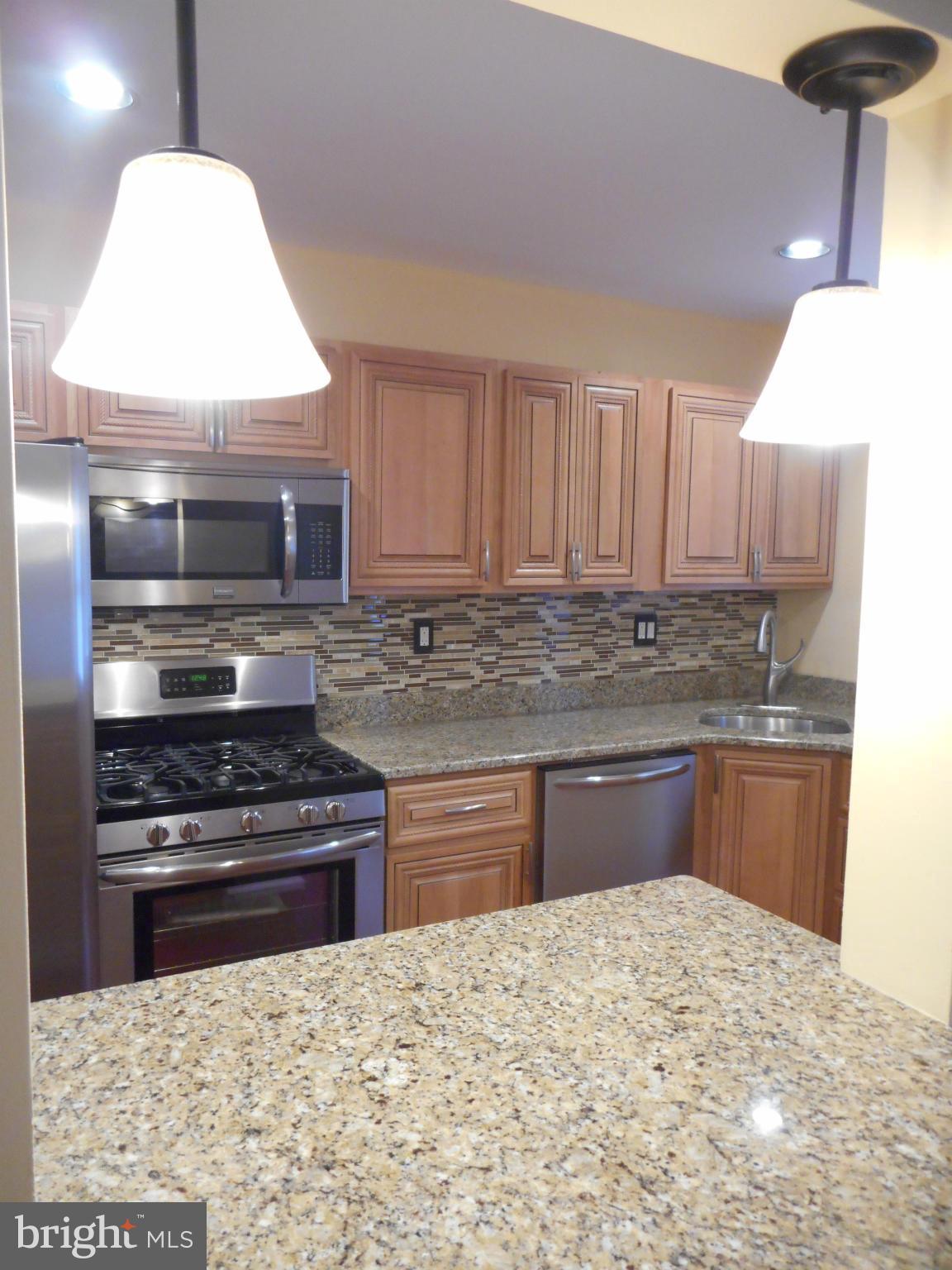 3906 Edgewood Road Baltimore, MD 21215 - Photo 25 of 29 View of Kitchen from Breakfast Bar