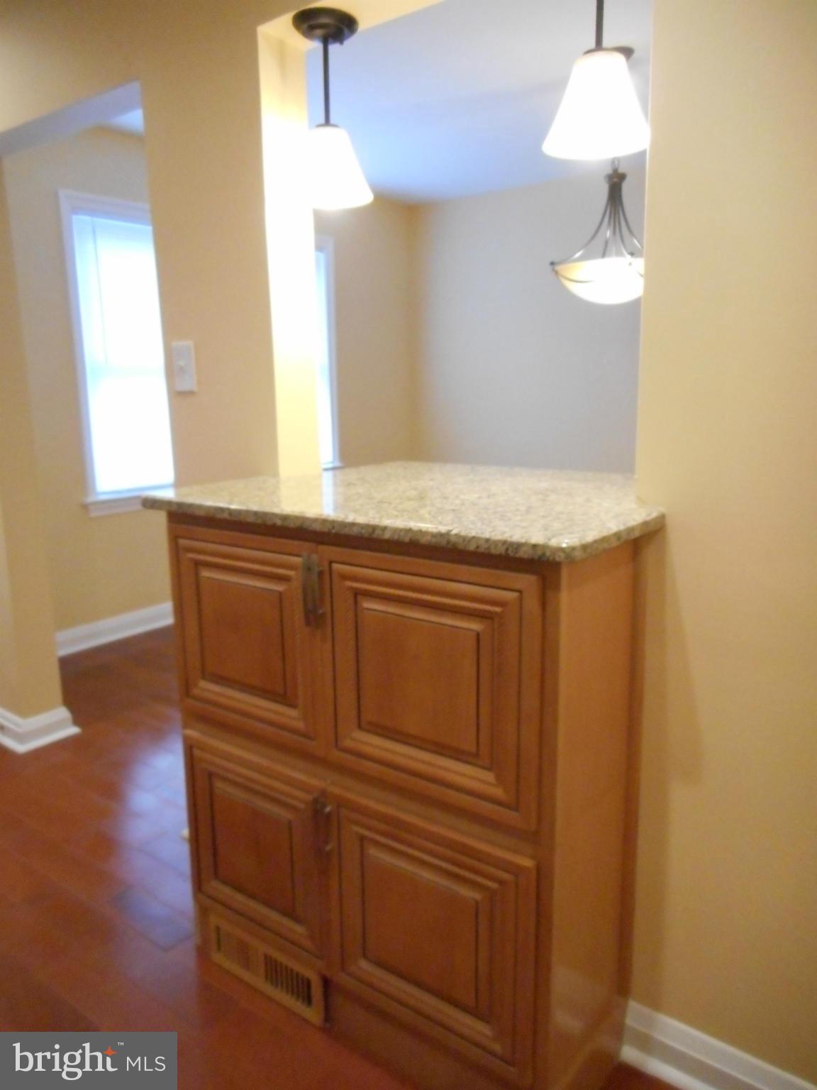 3906 Edgewood Road Baltimore, MD 21215 - Photo 8 of 29 Breakfast bar with cabinets