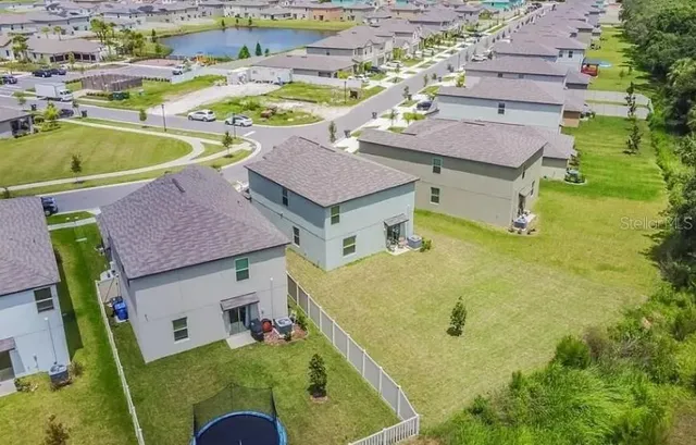 an aerial view of a house with swimming pool