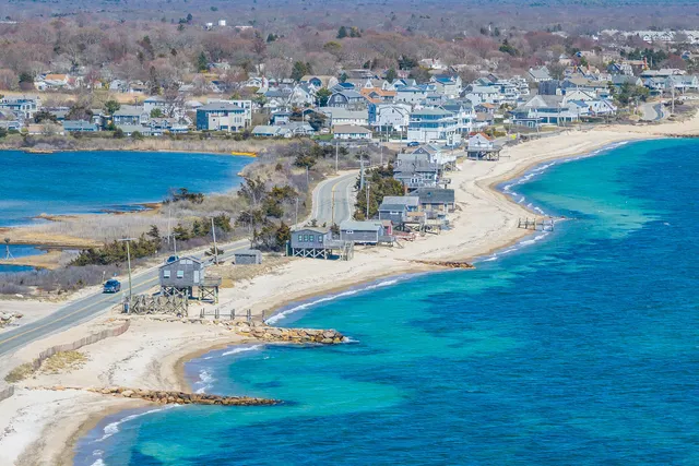 an aerial view of residential houses with outdoor space
