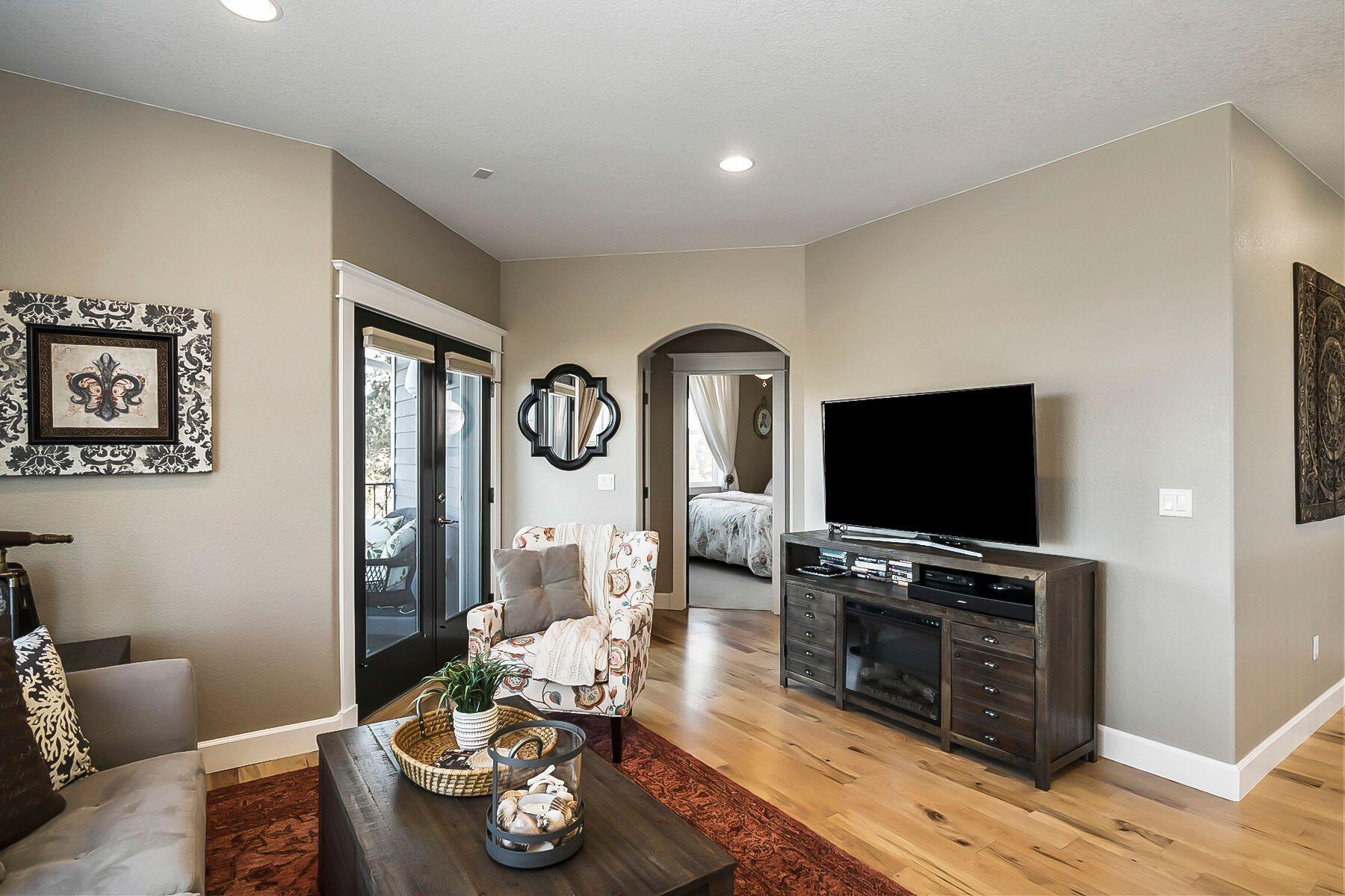 21530 Dale Road Bend, OR 97701 - Photo 24 of 46 a living room with furniture and a flat screen tv
