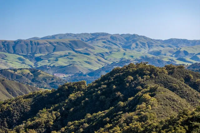 a view of a city with mountains in the background