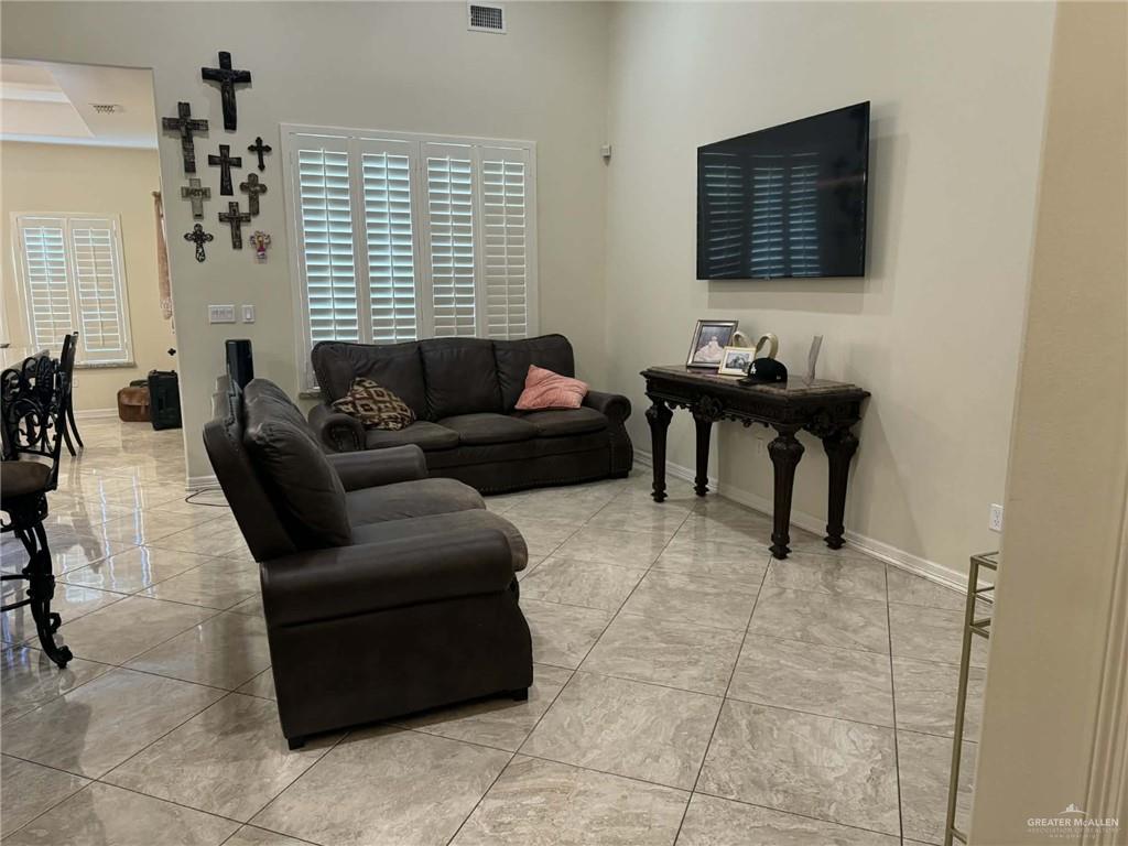 4014 Magdalena Street Mission, TX 78573 - Photo 3 of 9 a living room with furniture and a flat screen tv