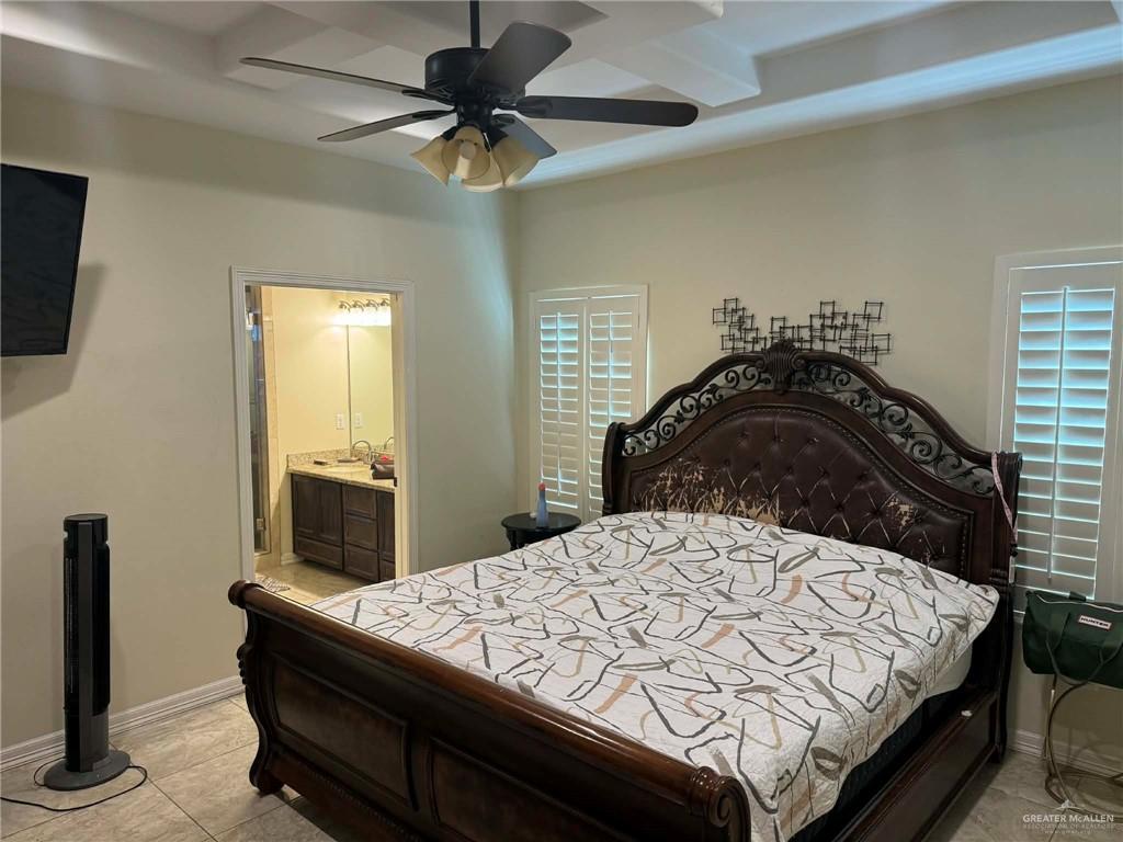 4014 Magdalena Street Mission, TX 78573 - Photo 8 of 9 a bedroom with a bed and a mirror