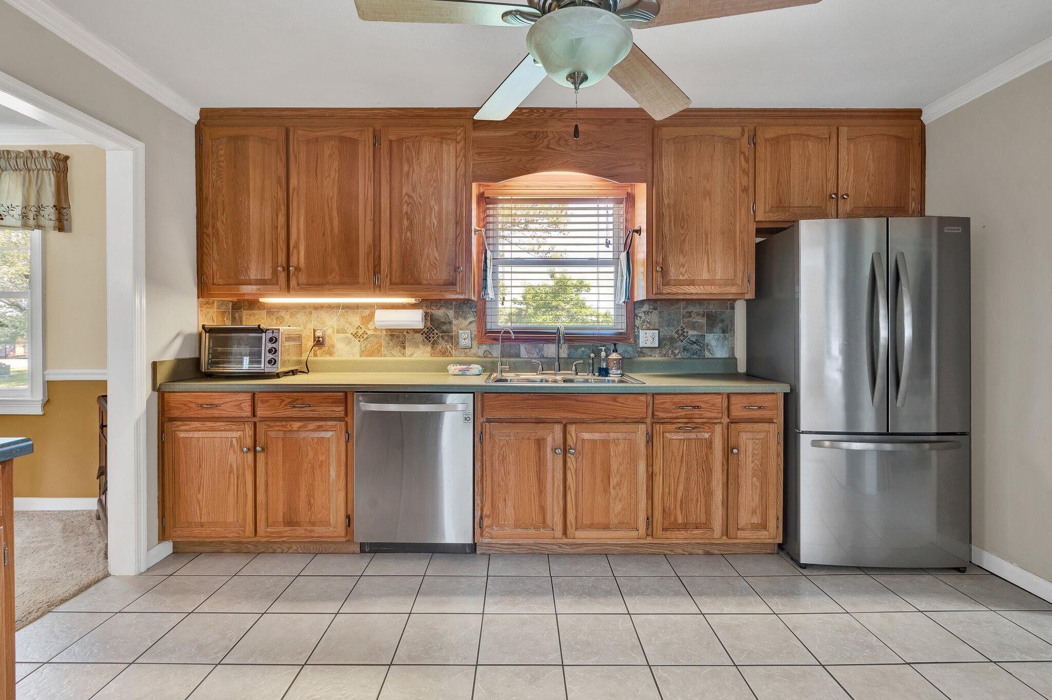 470 Armstrong Road Southeast Cleveland, TN 37323 - Photo 17 of 57 a kitchen with stainless steel appliances granite countertop a refrigerator sink and cabinets