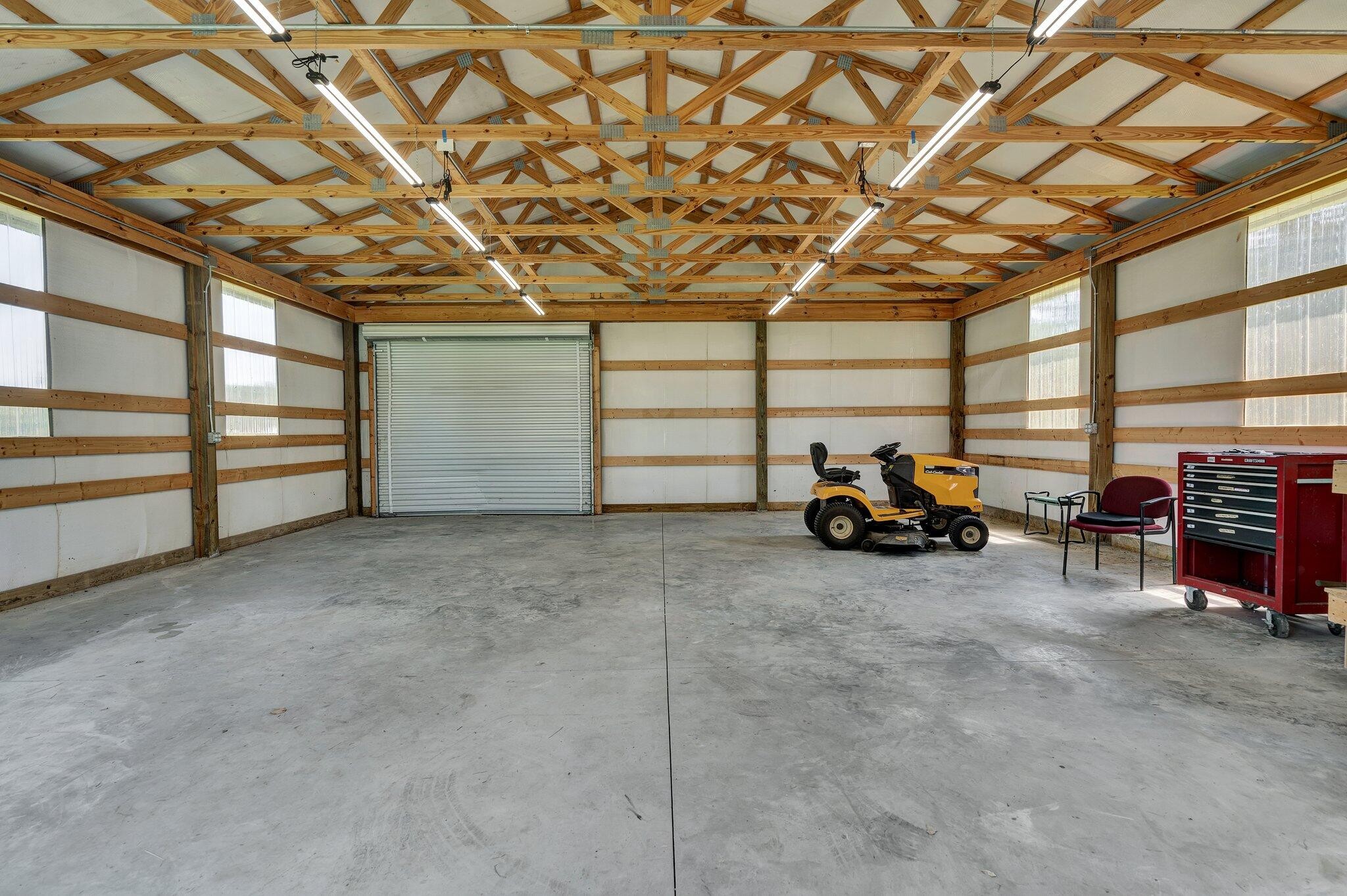 470 Armstrong Road Southeast Cleveland, TN 37323 - Photo 50 of 57 a view of a garage with furniture and a ceiling fan