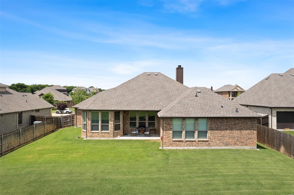 2618 Byrd Ranch Road Midlothian, TX 76065 - Photo 31 of 38 a front view of a house with a garden