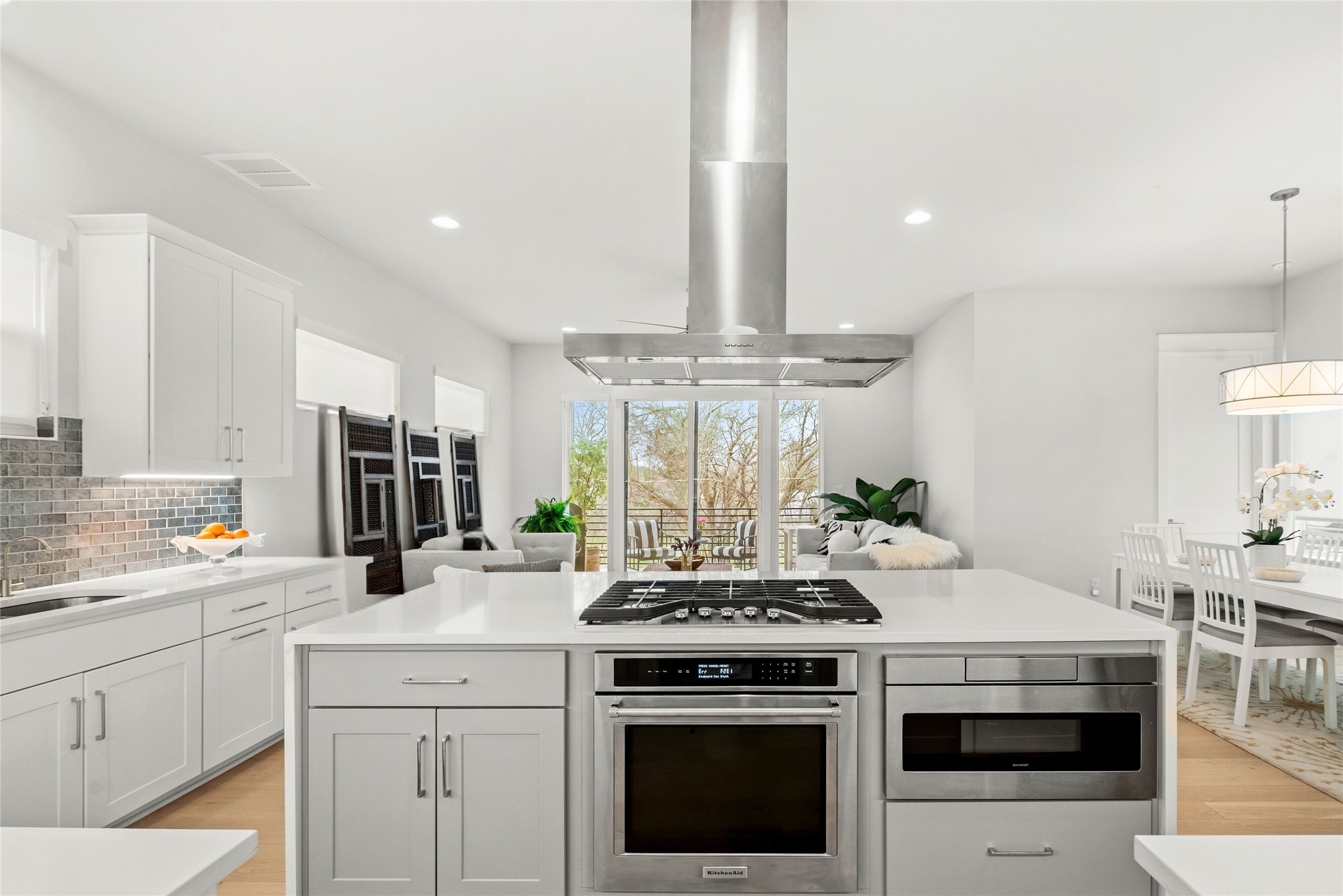 5002 Pecan Springs Road, Unit 8 Austin, TX 78723 - Photo 15 of 35 Gourmet Kitchen with stainless steel appliances, Quartz eat-in island - open to living and dining spaces