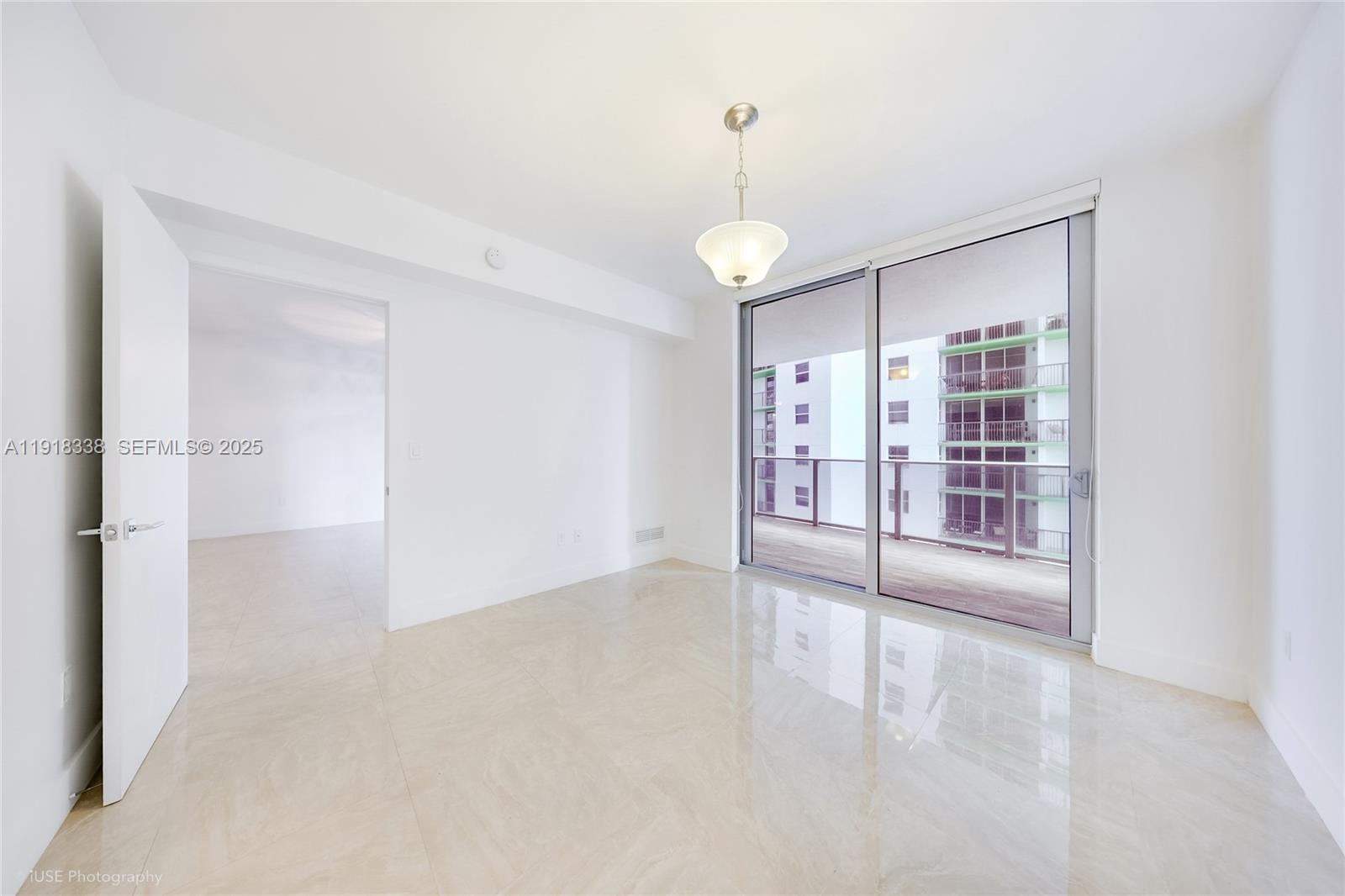 488 Northeast 18th Street, Unit 2304 Miami, FL 33132 - Photo 14 of 41 a view of an empty room with a window