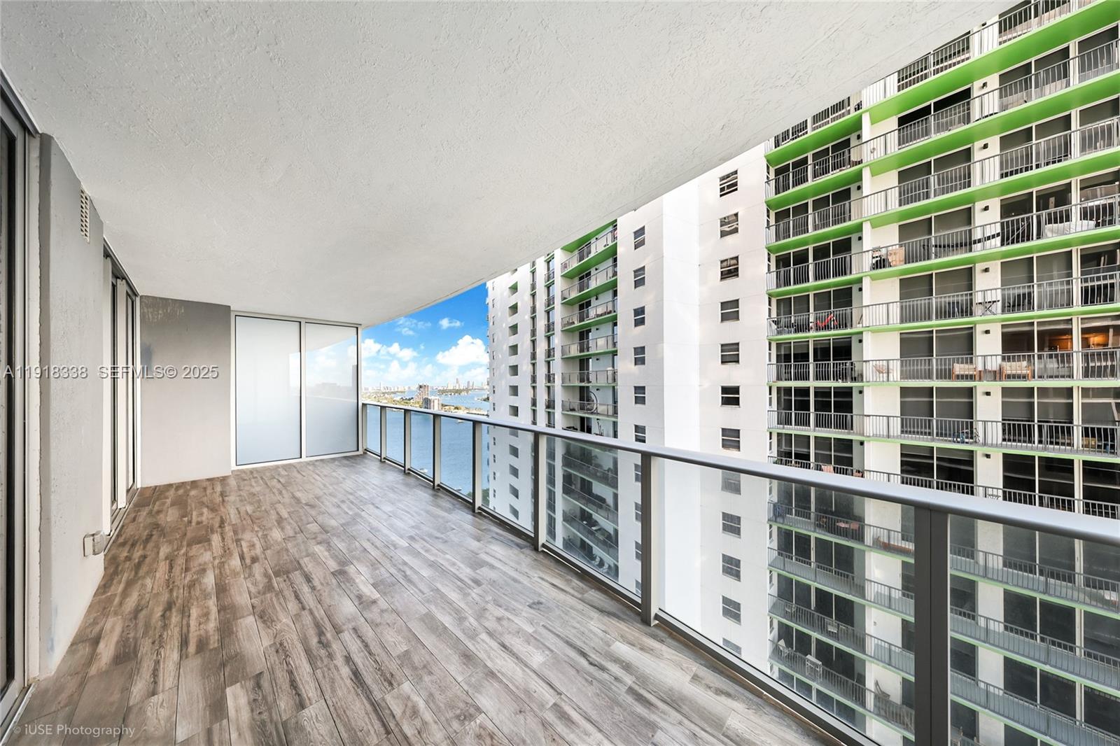 488 Northeast 18th Street, Unit 2304 Miami, FL 33132 - Photo 2 of 41 a view of balcony with wooden floor