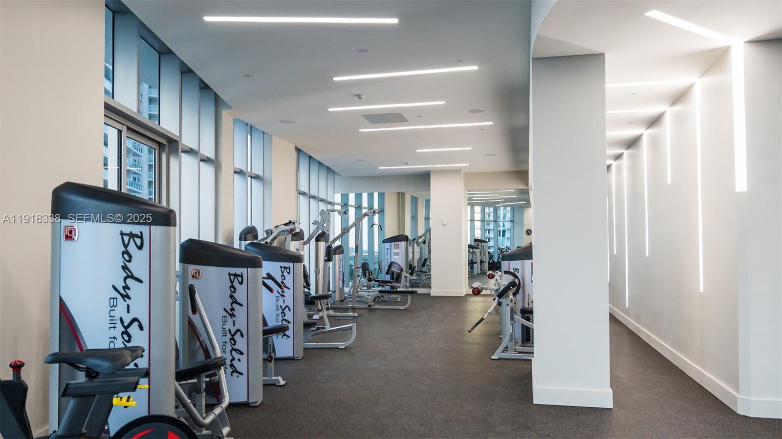 488 Northeast 18th Street, Unit 2304 Miami, FL 33132 - Photo 27 of 41 a view of a room with gym equipment