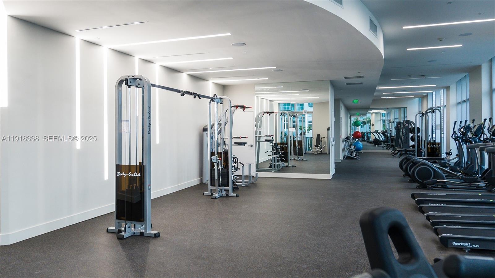 488 Northeast 18th Street, Unit 2304 Miami, FL 33132 - Photo 28 of 41 a view of a room with gym equipment