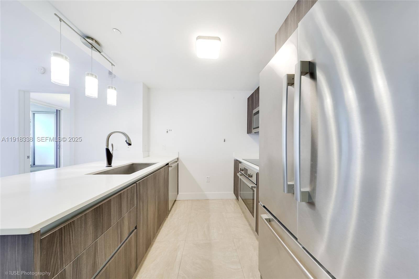 488 Northeast 18th Street, Unit 2304 Miami, FL 33132 - Photo 9 of 41 a view of a bathroom with sink and mirror