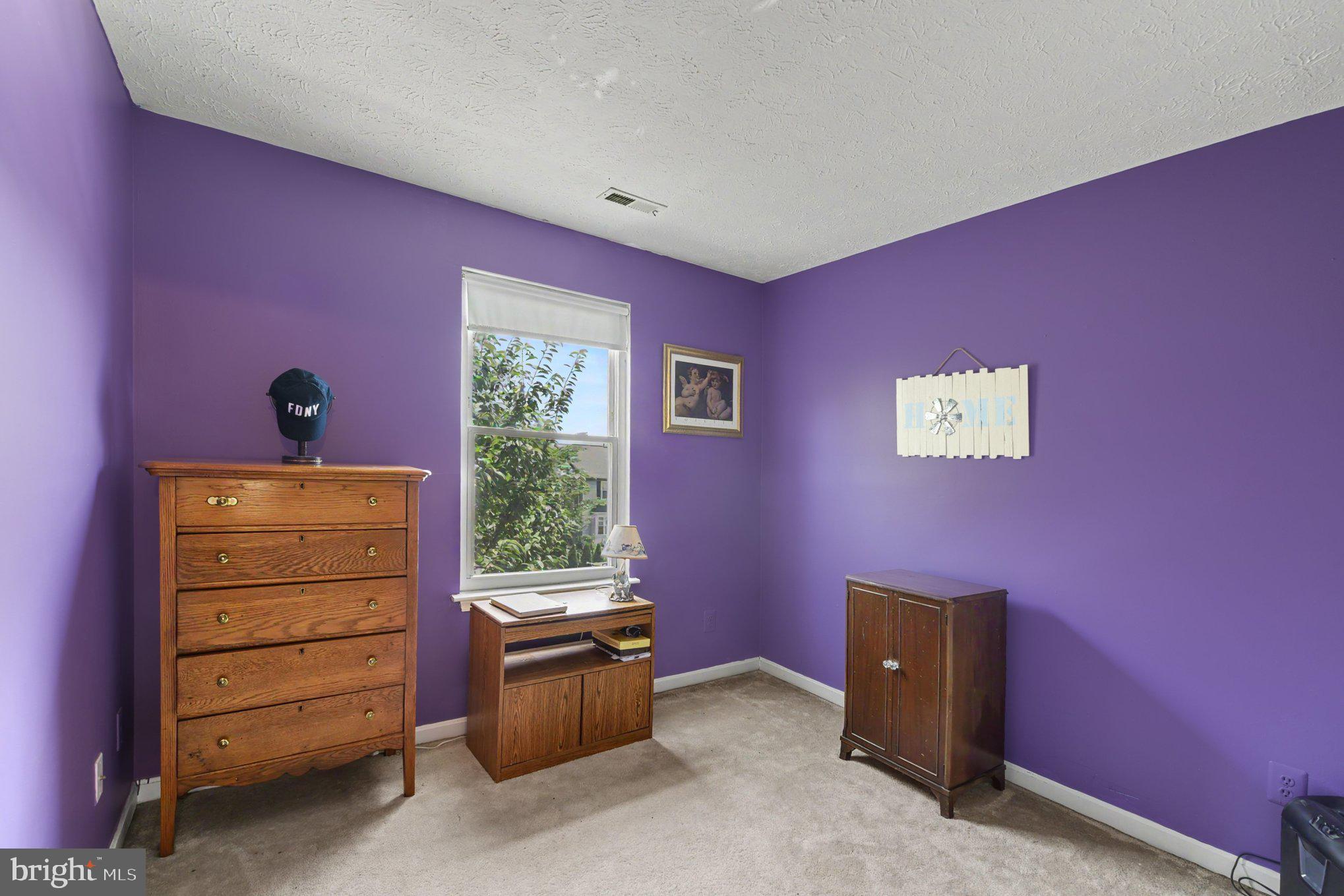 72 Powder View Court Nottingham, MD 21236 - Photo 20 of 26 Vibrant purple room with natural light.