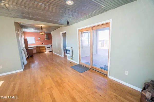 a kitchen with sink a stove and cabinets