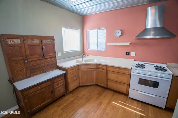 a kitchen with stainless steel appliances a refrigerator and a stove