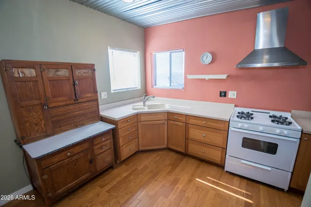 a kitchen with stainless steel appliances a refrigerator and a stove