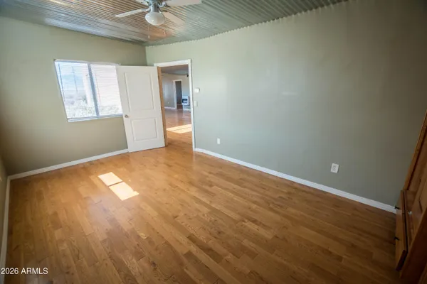 a view of backyard with deck and wooden floor