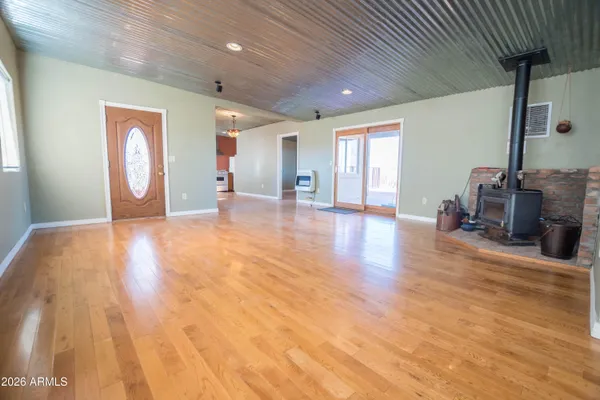a view of a kitchen with stove and cabinets