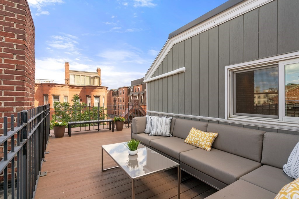 203 St Botolph Street, Unit 4 Boston, MA 02115 - Photo 21 of 26 a view of a patio with couches and potted plants