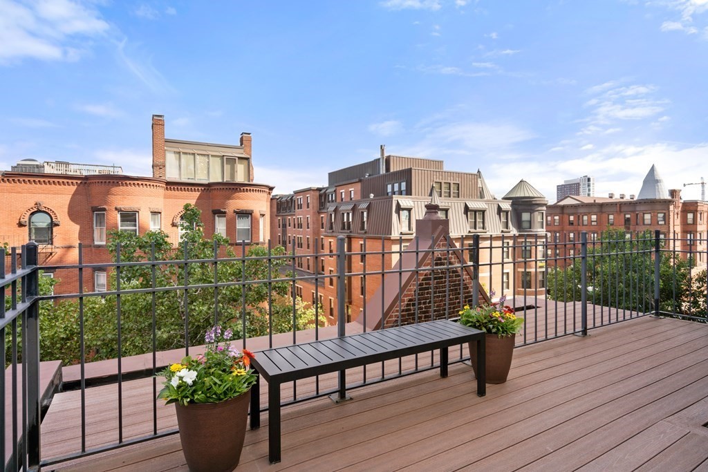 203 St Botolph Street, Unit 4 Boston, MA 02115 - Photo 23 of 26 a view of a balcony with an outdoor seating