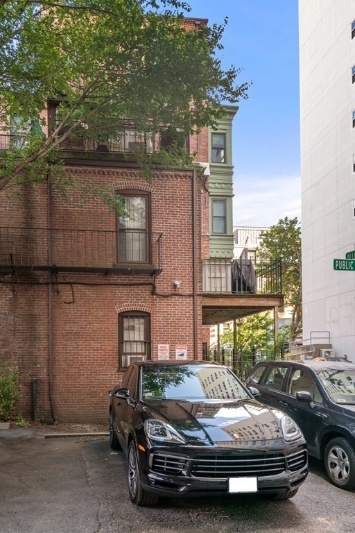 203 St Botolph Street, Unit 4 Boston, MA 02115 - Photo 25 of 26 a car parked in front of a house