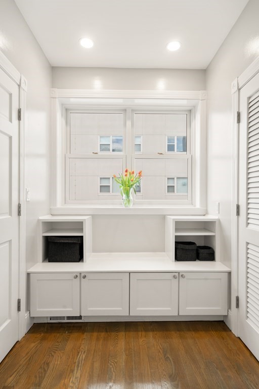 203 St Botolph Street, Unit 4 Boston, MA 02115 - Photo 9 of 26 a living room with hard wood floors and a window