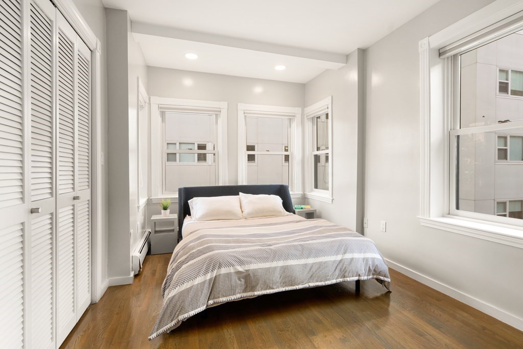 203 St Botolph Street, Unit 4 Boston, MA 02115 - Photo 10 of 26 a bedroom with a bed and a window