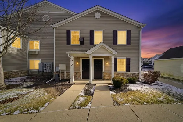 a front view of a house with yard